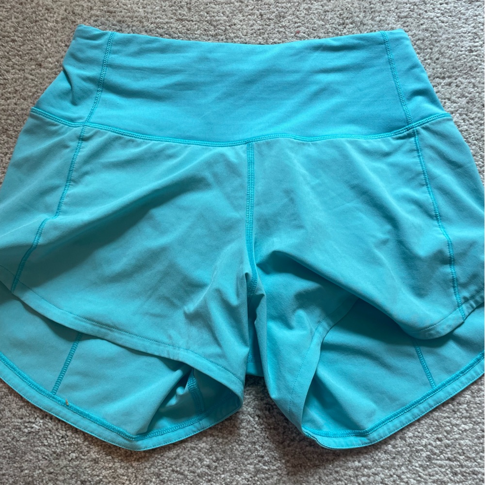 Lululemon Electric Turquoise 4” size 2